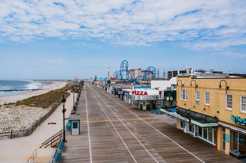 Aerial drone footage of the boardwalk down the shore